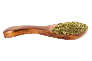 Dried fennel in a wooden spoon on a white background