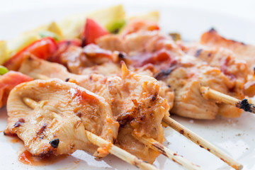 Close Up,Grilled chicken barbecue on bamboo skewers on white plate