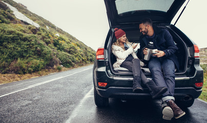 Couple having a coffee break during road trip © Jacob Lund