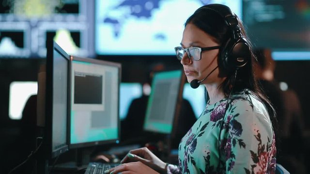 Attractive woman customer support phone operator at workplace