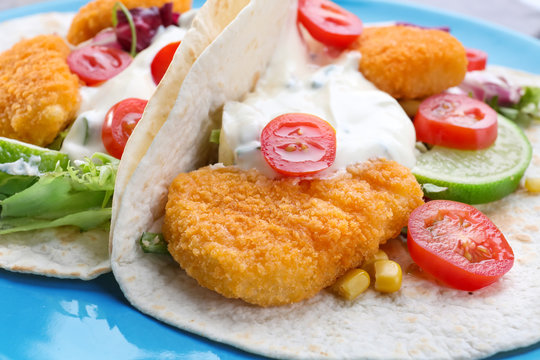 Plate with delicious fish tacos, close up