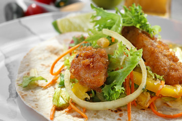 Delicious fish taco on plate, close up