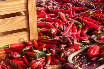 Harvesting chilli peppers. Preparing for drying spicy seasoning. Sale of spices.
