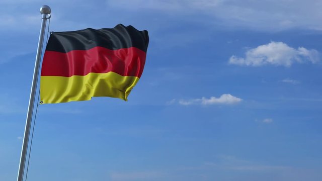 Commercial airplane landing behind waving German flag. Travel to Germany conceptual animation