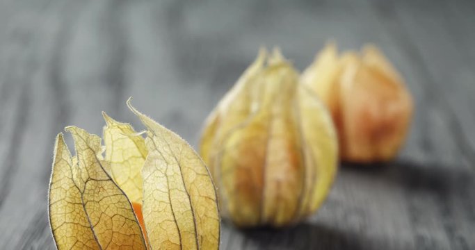 Physalis fruit on oak wooden table