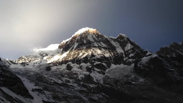 Timelapse with sunrise over Annapurna South with beautiful colours. Himalaya, Nepal