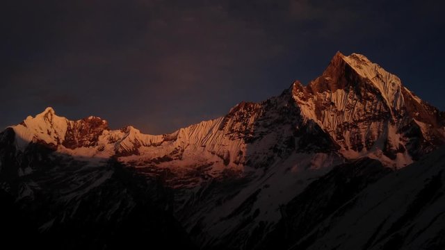 Timelapse with sunrise over Fish Tail with beautiful colours. Himalaya, Nepal