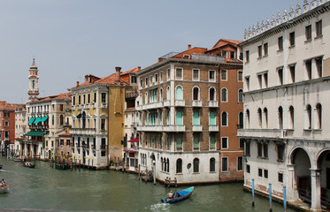 Fototapeta na wymiar Buildings and gondolas on the street in Venice.