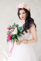 Pretty Fashion Model with Flowers. Girl in Lacy Dress