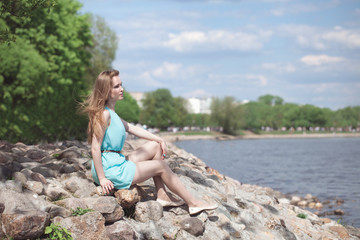 girl sitting on the rocks