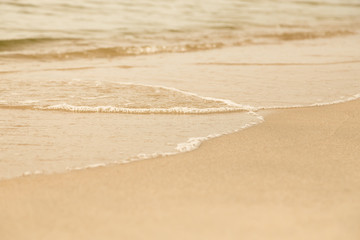 Fototapeta na wymiar sea sandy shoreline closeup background with copy space