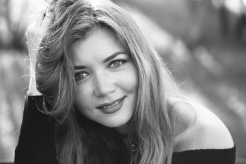 Girl with red hair in a black dress