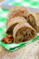 Whole grain bread with walnuts and sultanas, closeup
