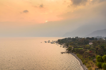 Panorama view to the village Panajachel at the lake Atitlan with amazing volcanos - Guatemala