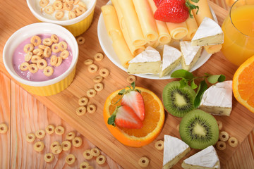Vanilla and blueberry yoghurt strawberry yellow and white cheese with pepper for breakfast diet