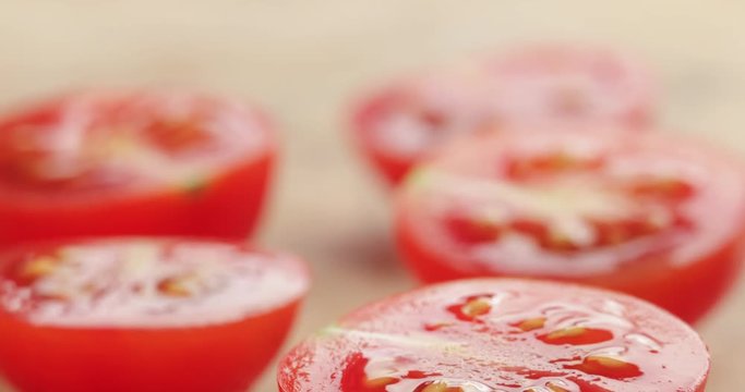 cut in half cherry tomatoes on wood table