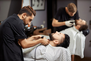 Man stylish client in barbershop