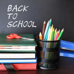 Back to school. Chalk sign on a chalkboard. © shake_pl