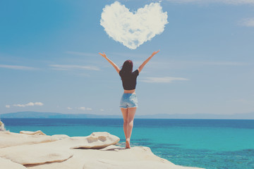 woman standing on the wonderful stone coast