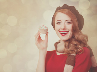 Redhead girl with cupcake