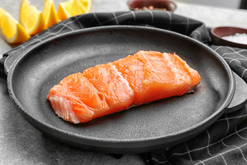 Slice of delicious salmon in pan, closeup