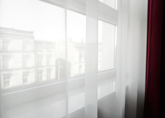 Transparent curtains on window
