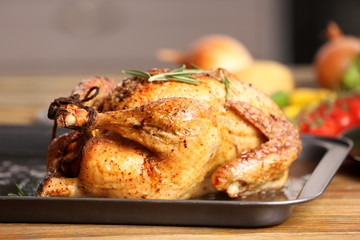 Delicious golden turkey on baking sheet