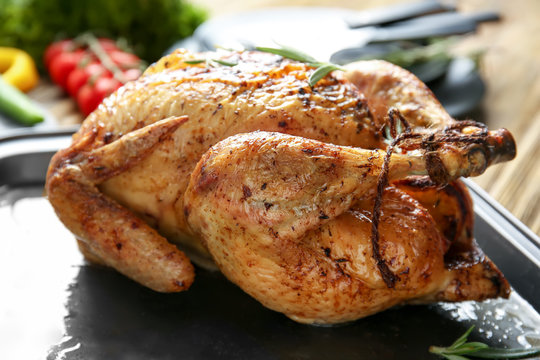 Delicious golden turkey on baking sheet