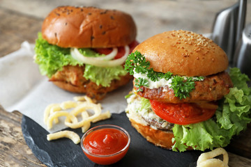 Tasty turkey burgers on slate plate