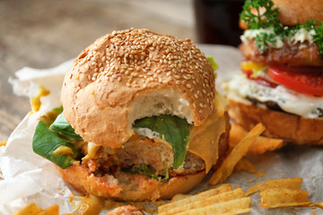Tasty turkey burger on table