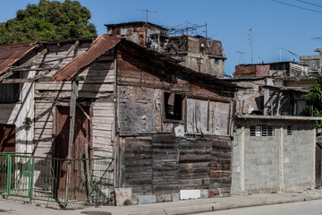 Fototapeta na wymiar Heavily dilipitated houses in Guantanamo, Cuba