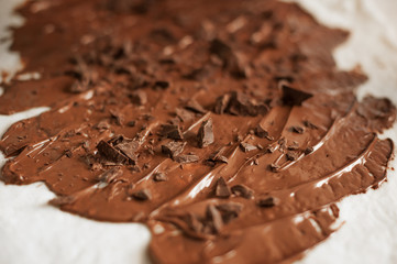 Professional confectioner making tasty cake with melted chocolate
