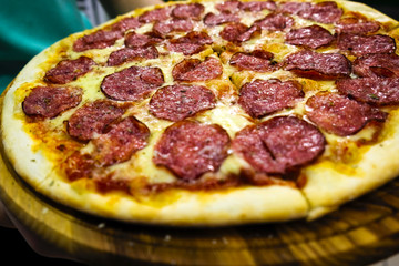 Eating Food. Close-up Of People Hands Taking Slices Of Pepperoni Pizza.