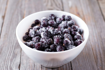 Frozen black currant in a bowl