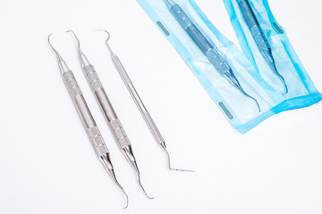 Modern dentist tools on a white background. Treatment and prosthetics of teeth.