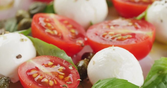 caprese salad with mini mozzarella balls and tomatoes