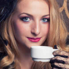 beautiful retro woman drinking coffee