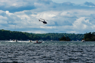 Helicopter flying over boats on the St. Lawrence River