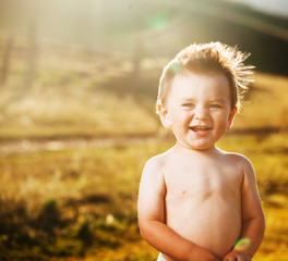 Happy baby at sunset