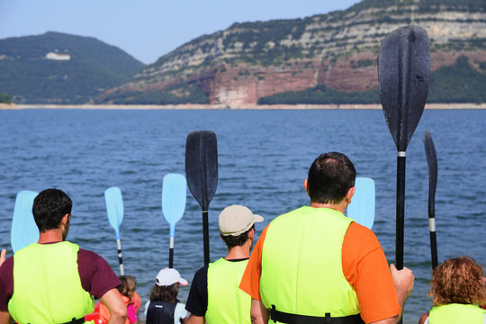 Tourist grouc and the instructor before the kayak activity. Adventure activity, Empty copy space for Editor's text.