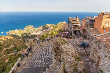 Panoramic view of small Village of Castelmola, overlooking town of Taormina with sea background, Sicily island, Italy © jsk12