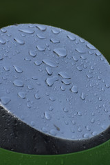 Dew drops on a metal post