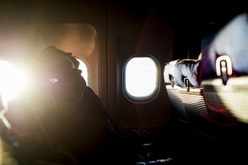 People sleep on the plane, early morning