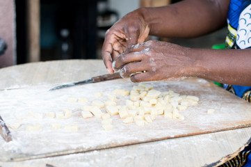 Closeup of female hands kneading flour