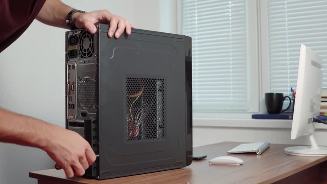Professional computer repairer man upgrading computer hardware. Shot in 4k