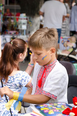 Boy in Ukrainian costume on the celebration Day of independence of Ukraine. Shooting on the street. 