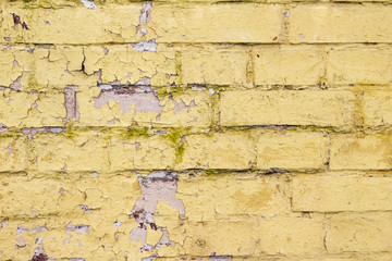 Yellow shabby brick wall background texture