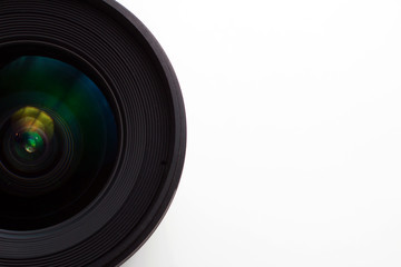 close-up view  of a camera lens on a white background