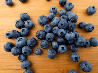 Blueberries isolated on a wooden board