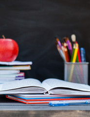 Notebook, books, pen and pencils. Schoolchild and student studies accessories. Back to school concept. September 1, knowledge Day. The teacher's day.
